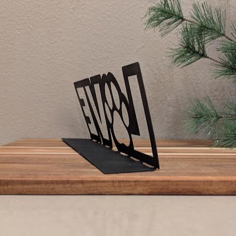 Rear quarter Image of a  black metal sign of the word "LOVE" and a paw for the "o" from Atomic Rat Rods & Metal Werks.