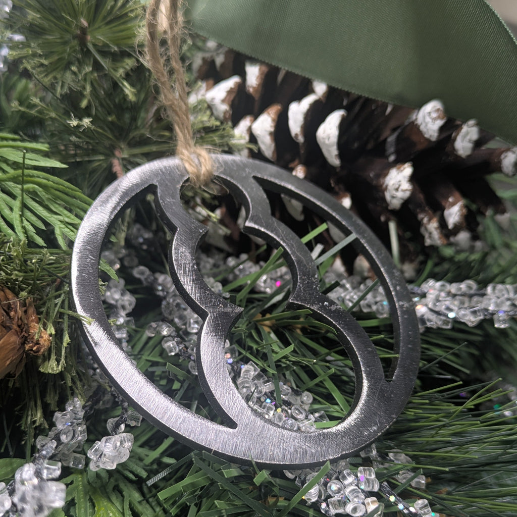 Alternative angle image of a simple, minimalist silver-colored snowman ornament on a Christmas tree from Atomic Rat Rods & Metal Werks.